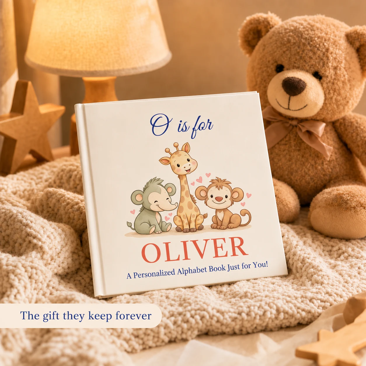 The personalized alphabet book with O is for Oliver on the cover, beside a teddy bear